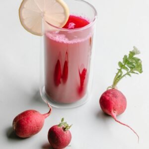 Bright and healthy radish juice with lemon slice, perfect for detox and refreshment.